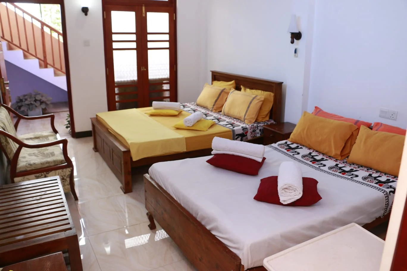 Deluxe Family Room — Comfortable sleeping area with premium bedding and cozy hill country atmosphere
