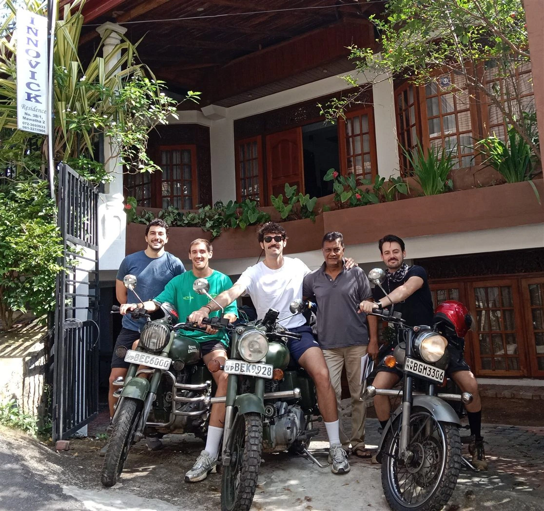 Guests with their touring motorcycles outside the Innovick Residence gate