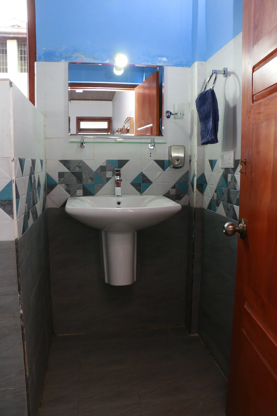 Deluxe Triple Room — Comfortable sleeping quarters accommodating up to 3 guests in full comfort