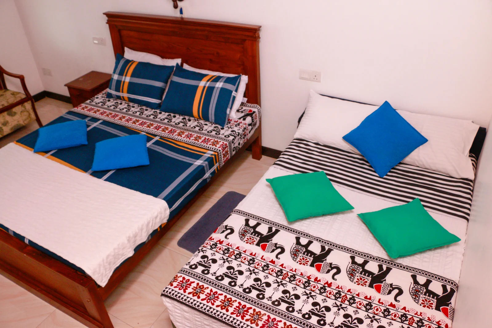 Deluxe Triple Room — Air-conditioned bedroom with timber ceiling details and hillside breeze