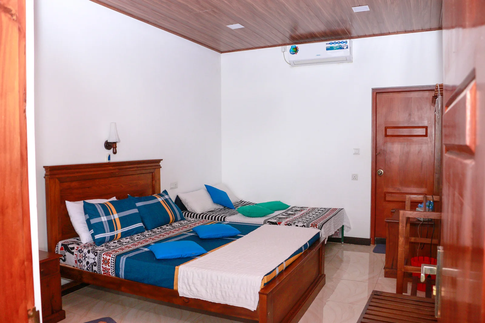 Deluxe Triple Room — Tranquil mountain and garden view from the bedroom windows